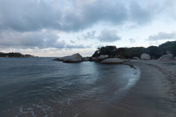 Beautiful blue dusk with cloudy sky and calm sea at arrecife beach into colombian tayrona national park