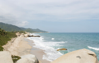 Colombian caribbean tayrona national park landscape with tropical jungle mountains and big rocks