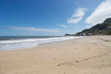 Photo sur Plexiglas Plage de Camps Bay, Le Cap, Afrique du Sud Beautiful virgin beach into colombian tayrona national park in sunny day with blue sky and jungle mountains
