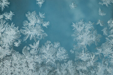 ice pattern on glass and blue background