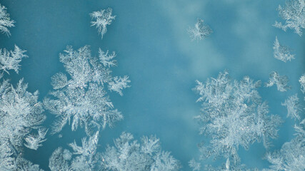 ice pattern on glass and blue background