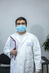 Doctor with mask and stethoscope. Portrait of a doctor 