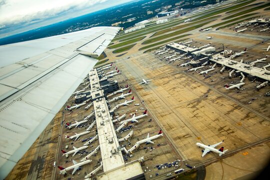 Atlanta, Georgia - 10/20/2018:  aerial view of commercial airliners at the passenger terminal at Hartsfield-Jackson International airport, Atlanta GA..  Passengers departing and just arriving