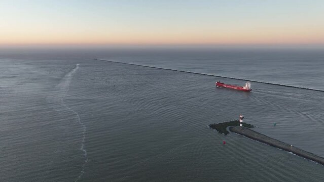 Aerial view on a large bulk ship leaving the port at hoek van Holland, gateway from Rotterdam.