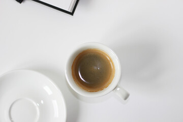 Minimal Workspace Flatlay with Cup of Coffee, Notebooks on White. Coffee Break.
