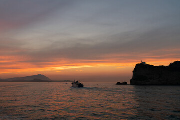 Sunset in the Campi Flegrei, land of volcanoes and terremoti. Image created from the ship that goes between Pozzuoli and Procida