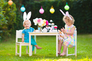Easter egg hunt. Kids with eggs.