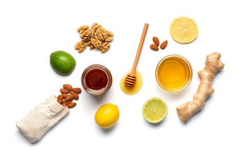 Composition of honey in a jars, lemon, lime, ginger isolated. - Powered by Adobe
