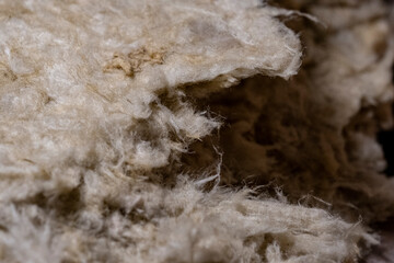 Close up of fibers of thermal insulation material, rock wool. Thermal roof insulation layer....