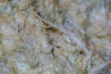 Close up of fibers of thermal insulation material, rock wool. Thermal roof insulation layer....
