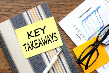 Key takeaways. bright sticker on a notepad. financial charts