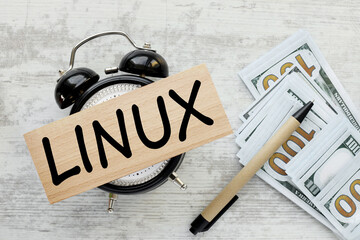 letters of the alphabet with the word Linux. Internet concept. Linux is a family of open source Unix-like operating systems, wooden block on desk clock