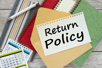 RETURN policy. Close-up of the workplace. Business concept. green and red notepad on the work desk....
