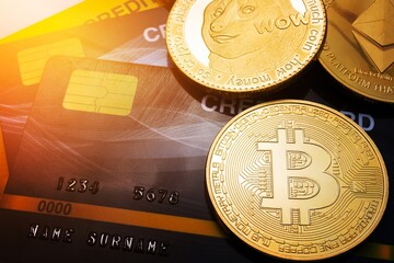 Close Up Gold bitcoin on credit card Concept background.