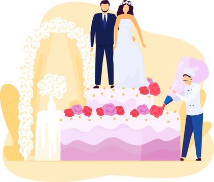 Bride and groom stand atop a huge wedding cake as chef decorates it. Pastry chef in white uniform adorning a multi-layered cake with roses.