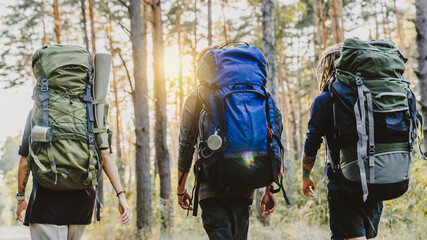 Young friends hiking in forest. Hiker camping in woods, traveling. Away from everything. escaping...
