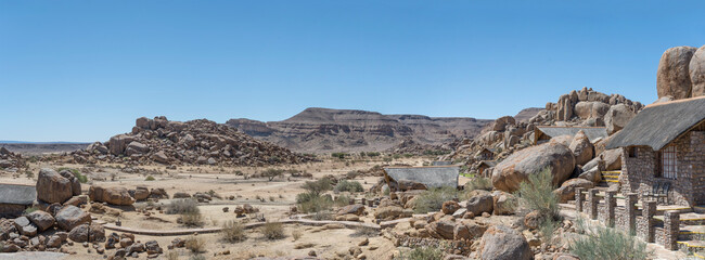 bungalows among Dolerite boulders at lodge in desert, near Hobas,  Namibia