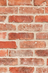 Red old brick wall of a building, texture background