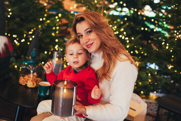 mother baby with candles in winter