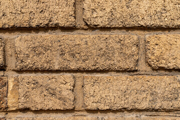 Red brick old wall of a building, texture background, close-up