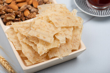 Tarhana chips, Turkish snack made with flour, wheat berries, mint, yogurt and spices also known as frik