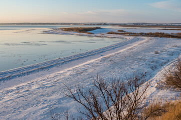 A spectacular winter landscape in the Russian countryside with waterfront. Surroundings of Taganrog.