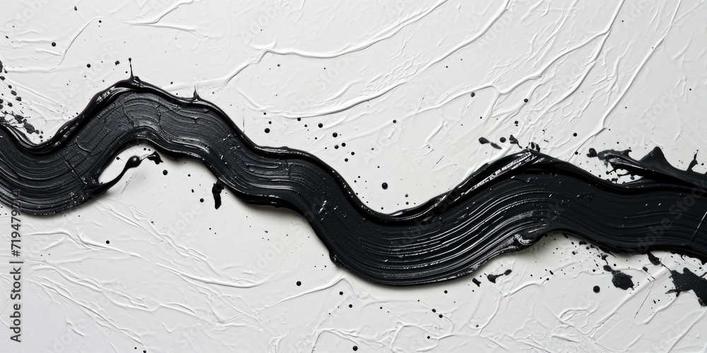 Poster Black paint is shown in close up on a white wall. This image can be used for various design projects