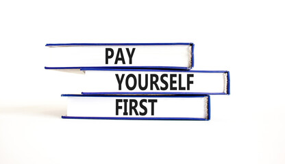 Pay yourself first symbol. Concept words Pay yourself first on beautiful books. Beautiful white table white background. Business and pay yourself first concept. Copy space.