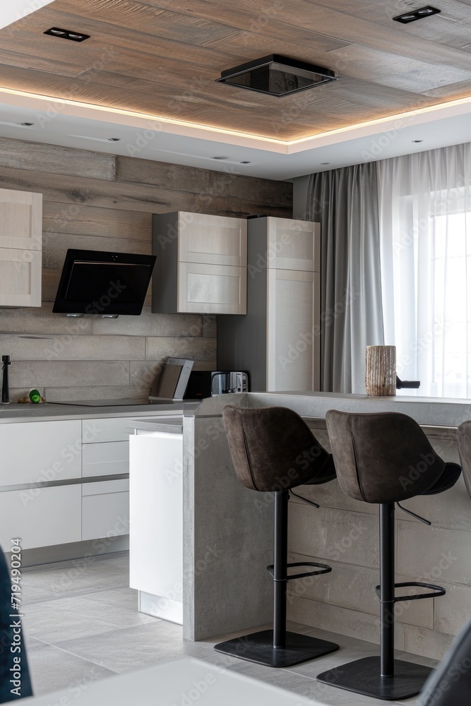 Poster a kitchen with a bar counter and two stools. can be used to depict a modern and stylish kitchen desi