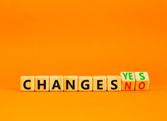 Changes yes or no symbol. Concept words Changes no to Changes yes on beautiful wooden cubes. Beautiful orange table orange background, copy space. Business and changes yes or no concept.