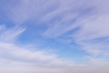 Naklejka na ściany i meble Beautiful soft gentle cloudy blue sky with white cirrus clouds, abstract background texture