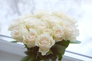 Bouquet of white roses on a white background close-up.