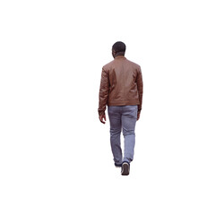 Fototapeta premium Homme de type Africain vu de dos en veste marron marchant calmement, jeans clairs et chaussures sombres, promenade par temps automnal