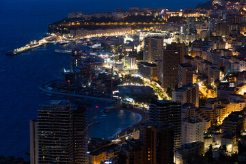 Monte Carlo panorama illuminated by night. Urban landscape with luxury architecture.