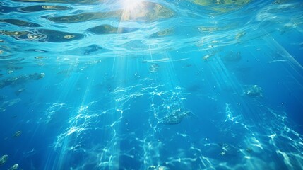 Underwater view of coral reef with blue water and sunbeams