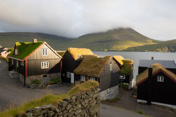 Houses with turf roofs, Bour village, vagar island, faroe islands, denmark, europe
Sunny summer view of Saksun village with typical turf-top houses.
Traveling concept background.