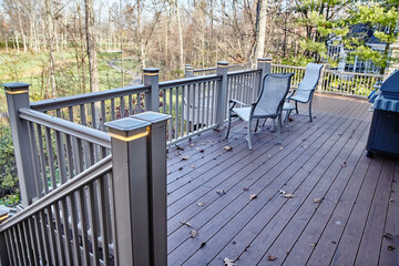 Tranquil Backyard with Wooden Deck and Adirondack Chairs - obrazy, fototapety, plakaty