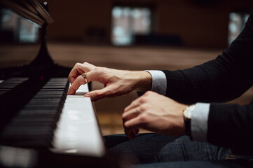 Hands of a pianist playing piano