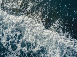 Waves with sea foam. Aerial view background/wallpaper.