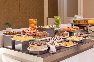 Buffet of Delicious Sweet Desserts on the Table. Arab Sweets, Mixed Fruits, and Cakes.