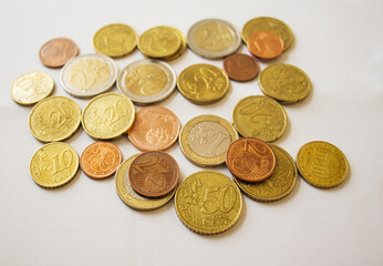 different euro coins lie on a white background, top view, close up