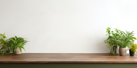 Empty wooden forest green table over white wall background 