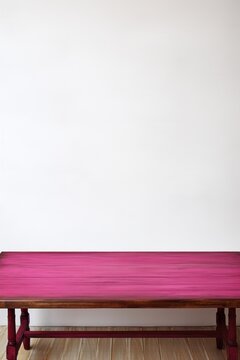 Empty wooden magenta table over white wall background