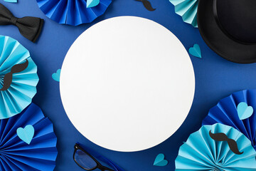 Dad day: a tribute to fatherhood. Top view shot of paper party props, bowtie, glasses, black hat, paper hearts, mustaches on blue background with blank circle for ad or text - Powered by Adobe