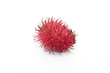 Rambutan fruit is round, red with hairy skin on a white background