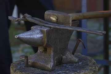 pincers and hammer on an anvil