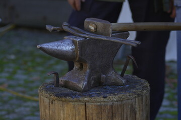 anvil on a stump and a hammer