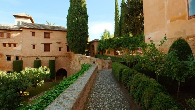The Alhambra Palace - Palace of Partal displaying exquisite Moorish architecture and lush vegetation in Granada, Andalucia, Spain