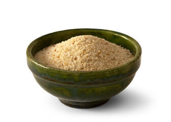 View of a green ceramic bowl filled with breadcrumbs isolated on empty background