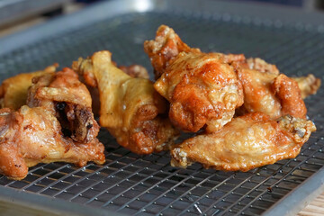 Chicken wings barbecue roasted with sauce. Fried chicken wings, homemade, food for restaurant, menu, advert or package, close up. American cuisine.